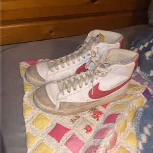 Nike White High-Top Sneakers with Red Swoosh Accent